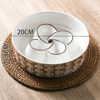 White ceramic bowl with brown interior design on a woven placemat, measurement labels shown.