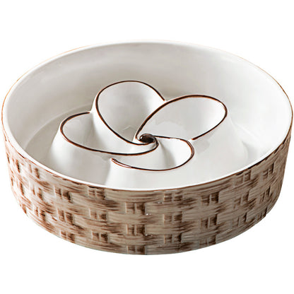 Decorative ceramic bowl with wicker-like base and floral design on a white background
