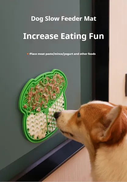 Dog slow feeder mat with a dog interacting with it on a gray surface.