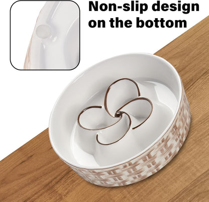 White pet bowl with brown patterns on a wooden surface, highlighting the non-slip design.